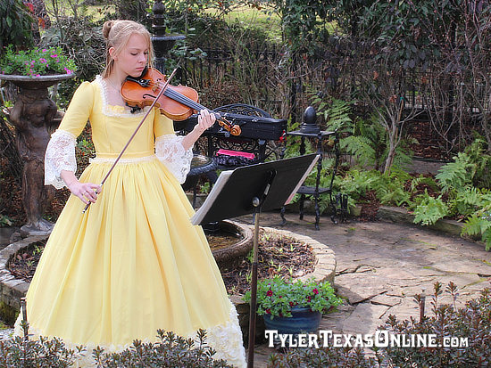 Young violin player entertaining the crowd at the opening of the Tyler Azalea Trails
