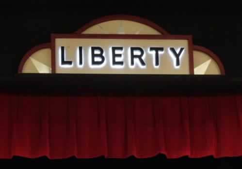 "Liberty" signage over the stage in the Liberty Hall